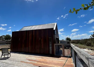 Timber-clad cabin and wide hardwood deck