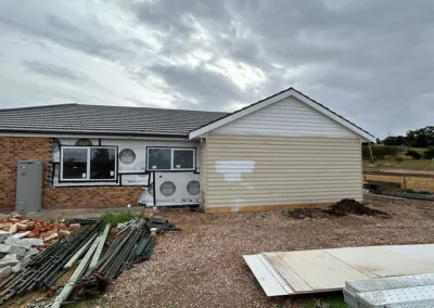 Weatherboard extension on a brick home