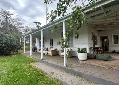 Covered verandah with timber posts on a weatherboard home