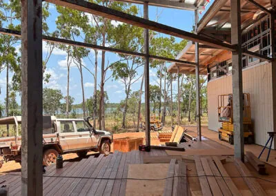 Covered hardwood deck taking shape beside the bush