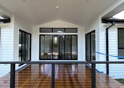 Hardwood deck and balustrade at the entry of a weatherboard home