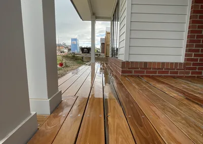 Hardwood decking along the side of a weatherboard home