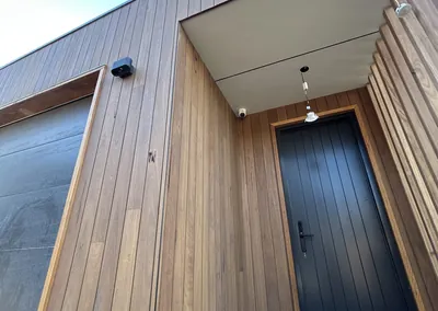 Vertical timber cladding and entry door on a new home